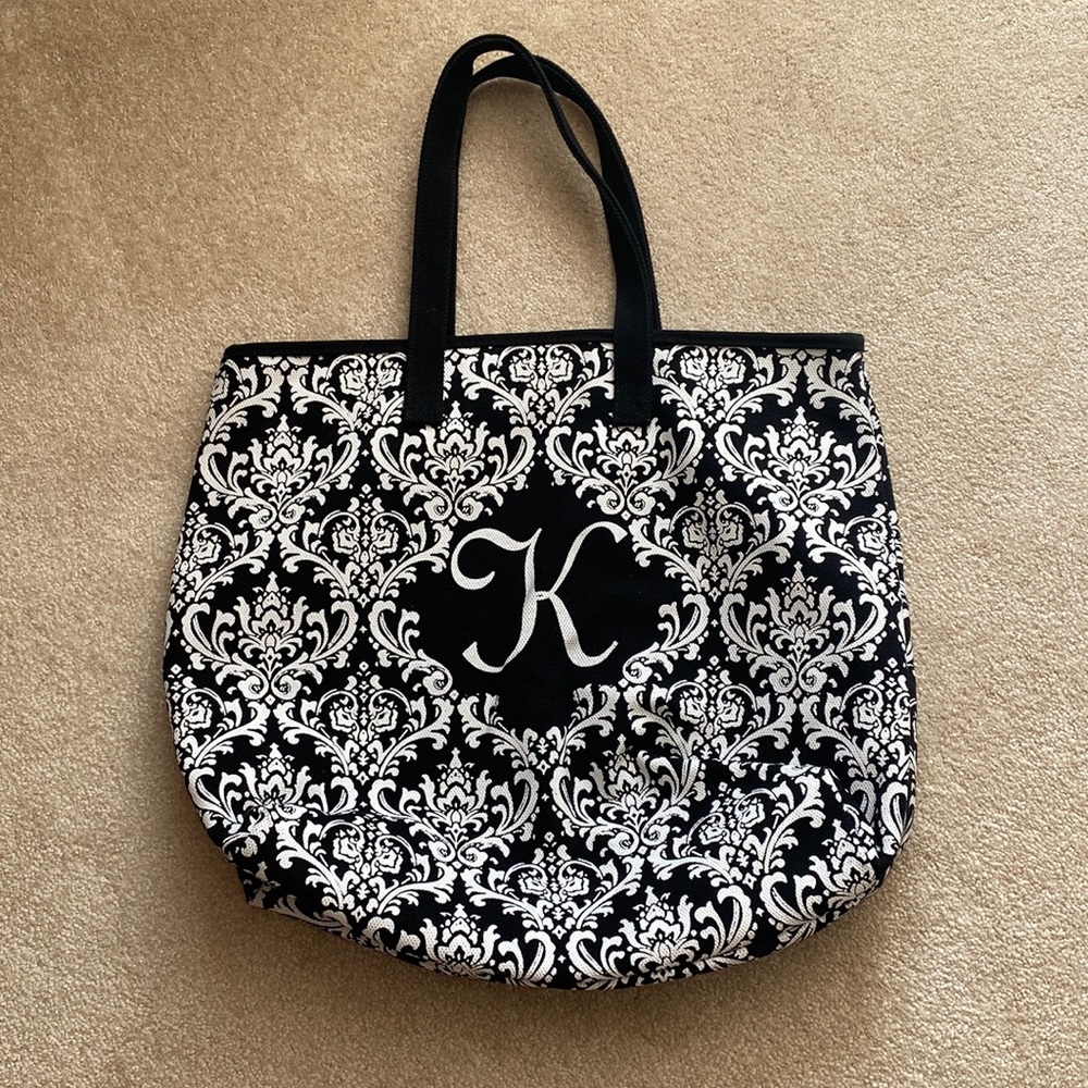 Black and white monogrammed “K” tote